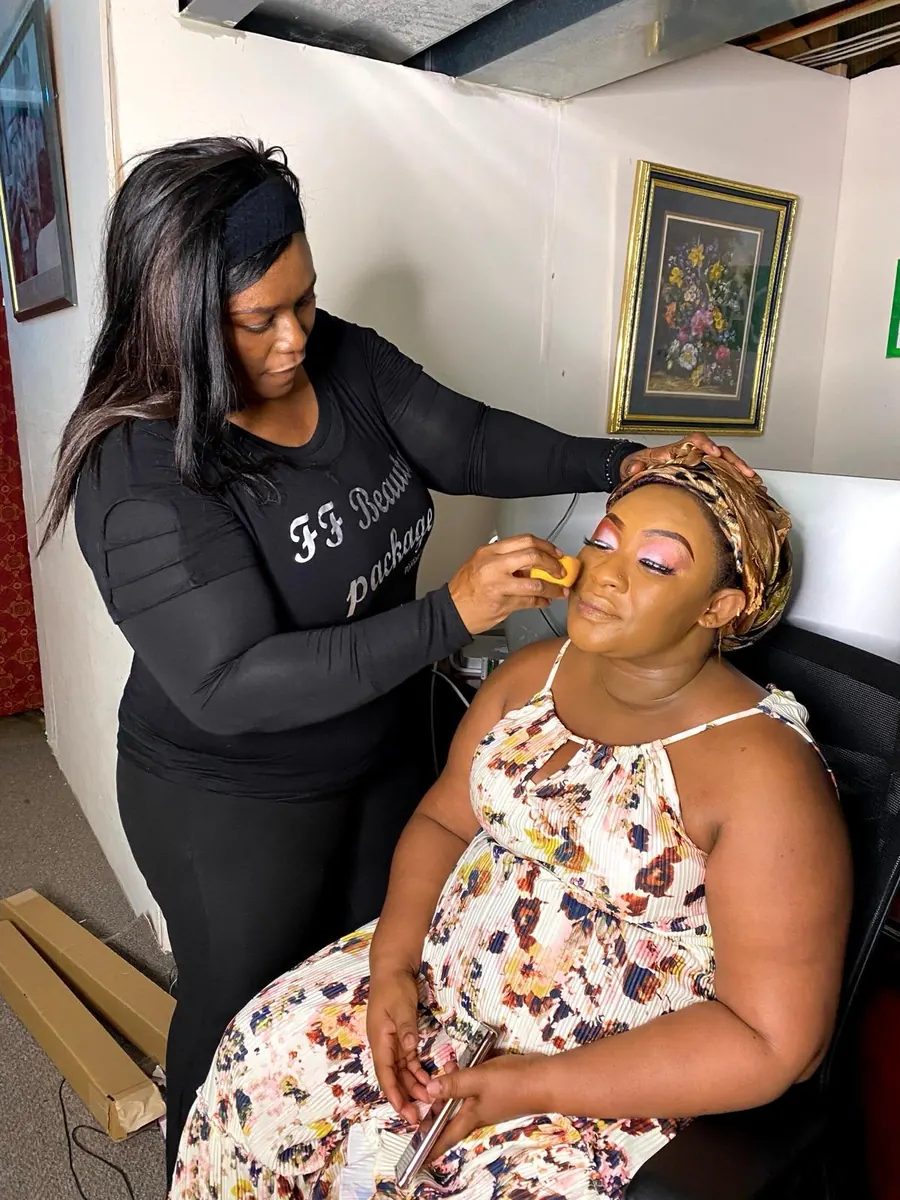 FF Beauty artist applying makeup to a client