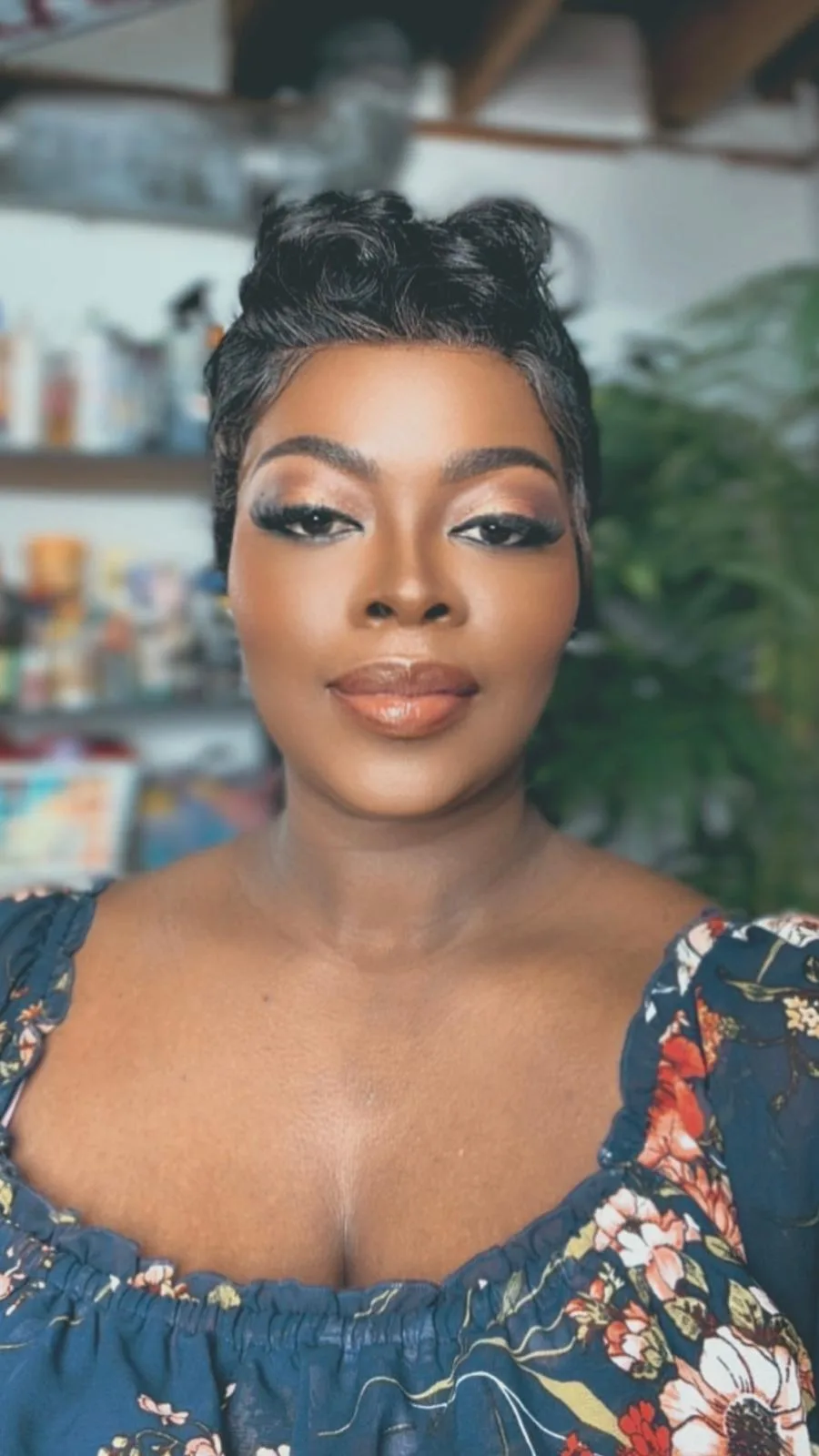 Finished glam smoky-eye makeup with full lashes and a glossy lip