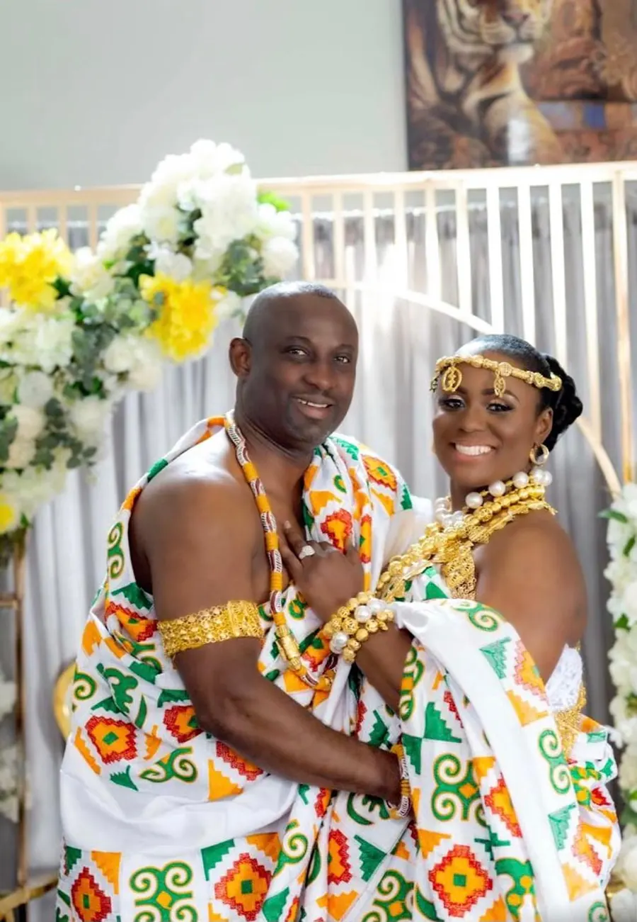 Couple styled head to toe in traditional kente for their ceremony