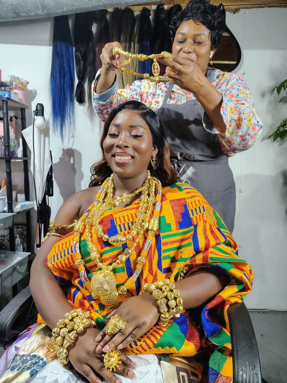 Dressing a bride in traditional kente cloth and gold jewelry, start to finish